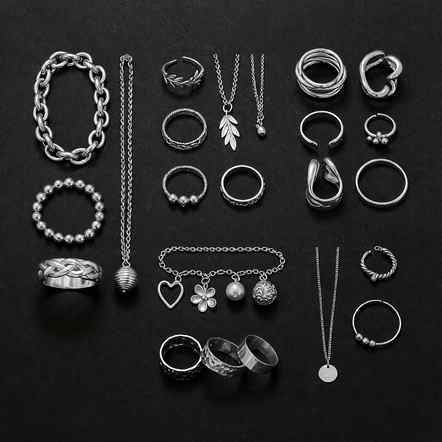 Flat lay of assorted 925 sterling silver necklaces, rings and bracelets for marketing line planning