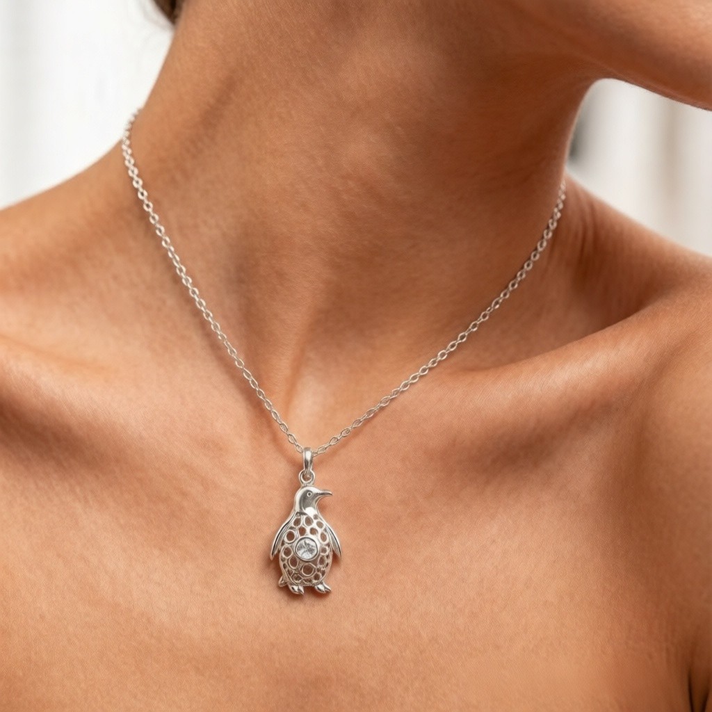 Emperor Penguin Pendant worn on the neck by a model, custom 925 sterling silver necklace
