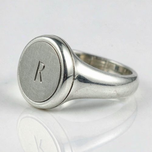 Close-up of a 925 silver piece with custom logo engraving