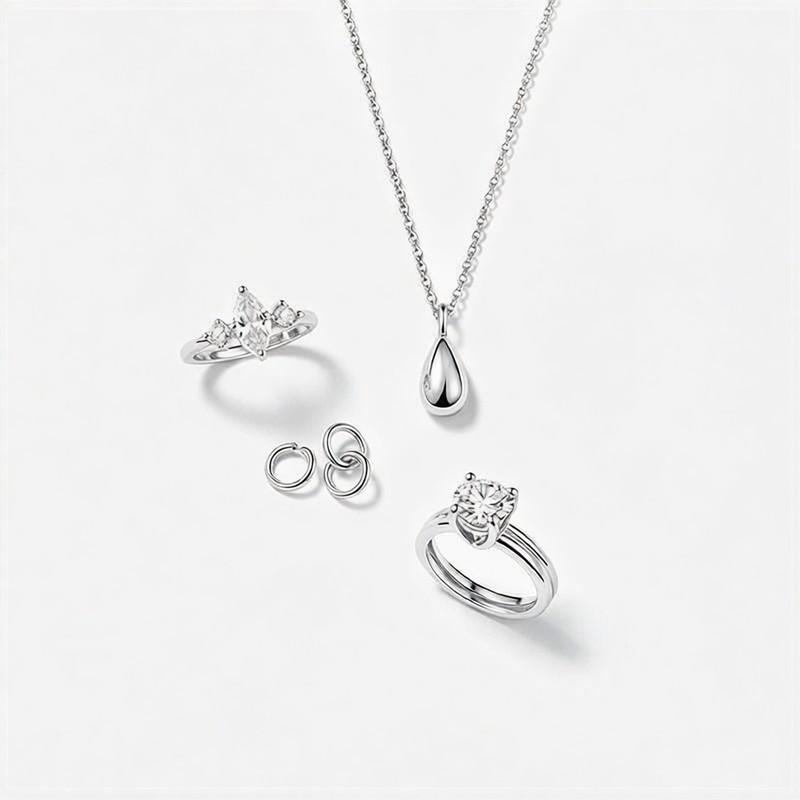 Curated 925 silver jewelry flat lay on white background