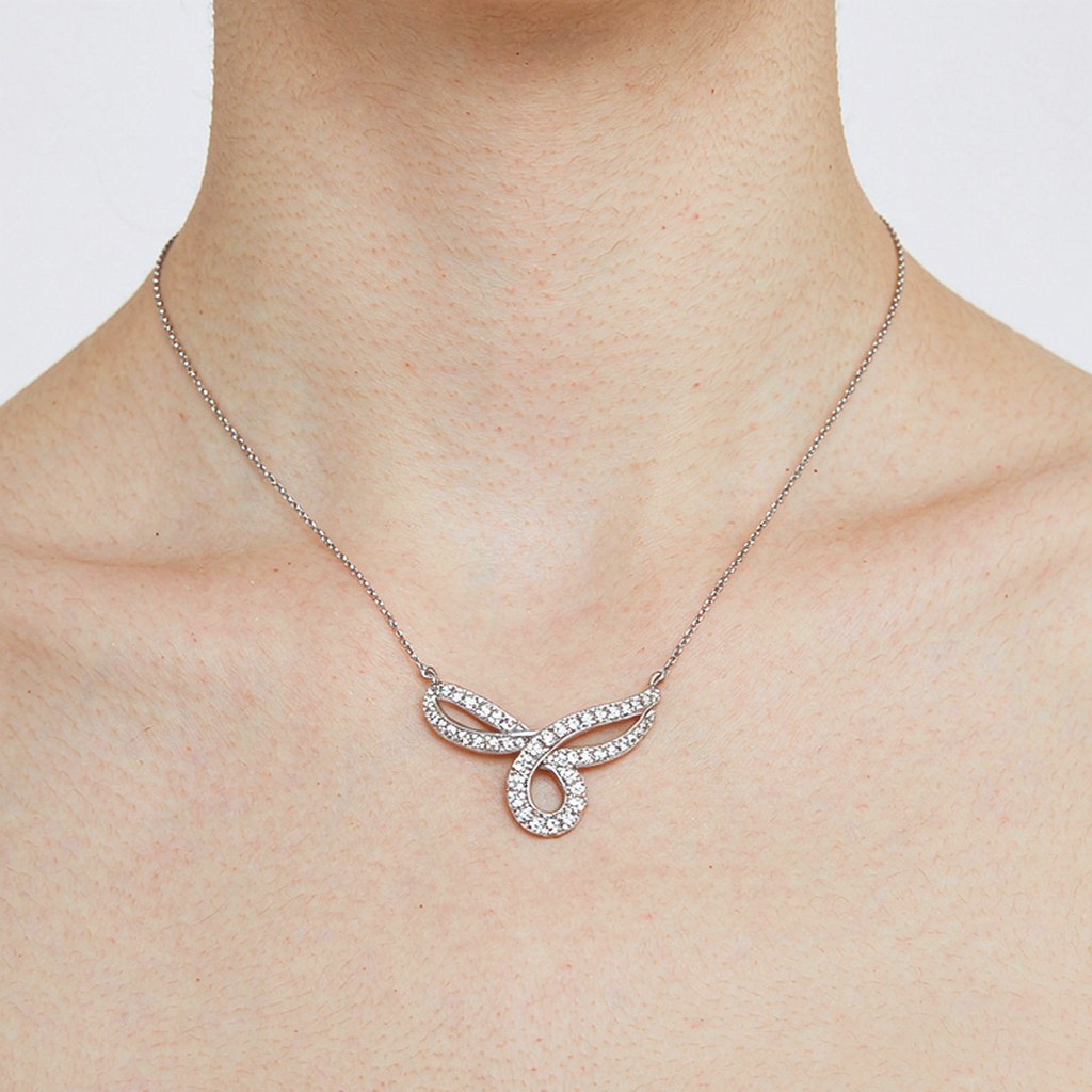 Interlocking Loop Pave Pendant Necklaces on-model styling