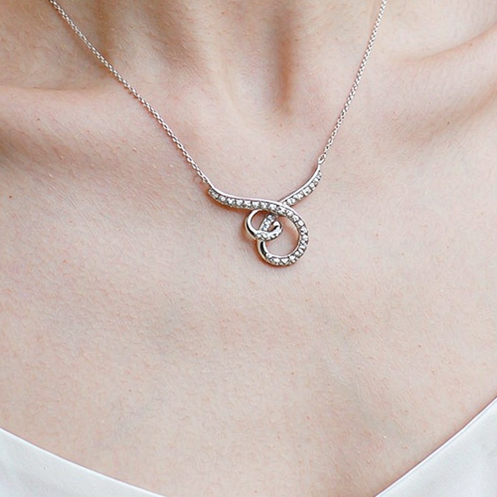 Intertwined Knot Pave Pendant Necklaces on-model styling