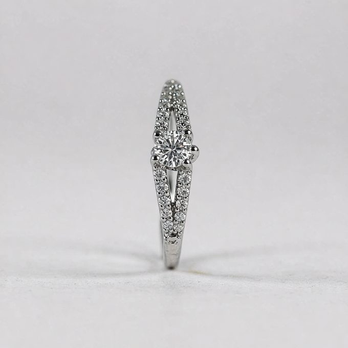 Close-up of a 925 sterling silver ring with a cubic zirconia stone on a clean white background