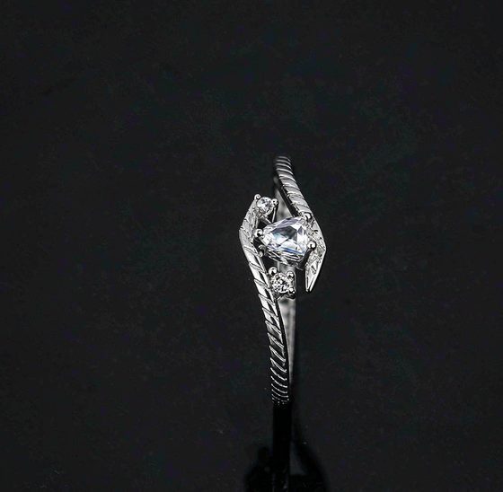 925 sterling silver custom ring with cubic zirconia on dark surface