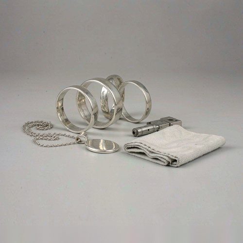 925 sterling silver rings and a pendant prepared for a custom jewelry production run
