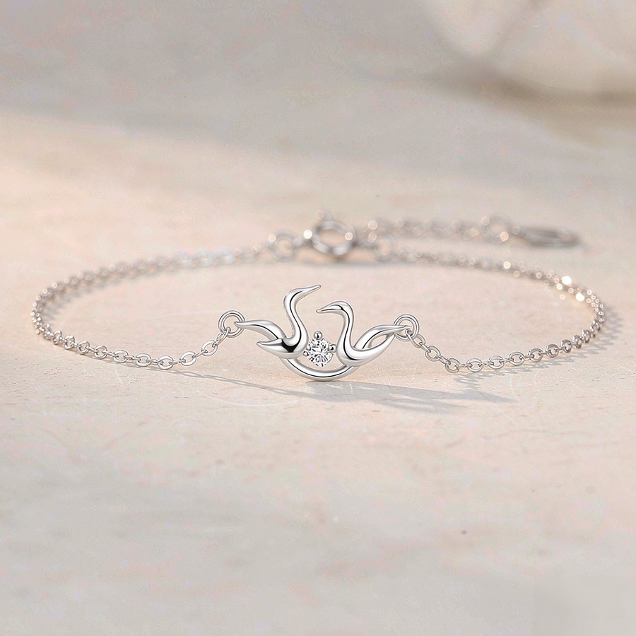 Sterling silver crane bracelet with two interlocking birds