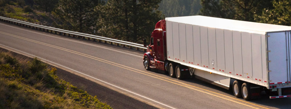 Logistics truck fleet operating on a highway